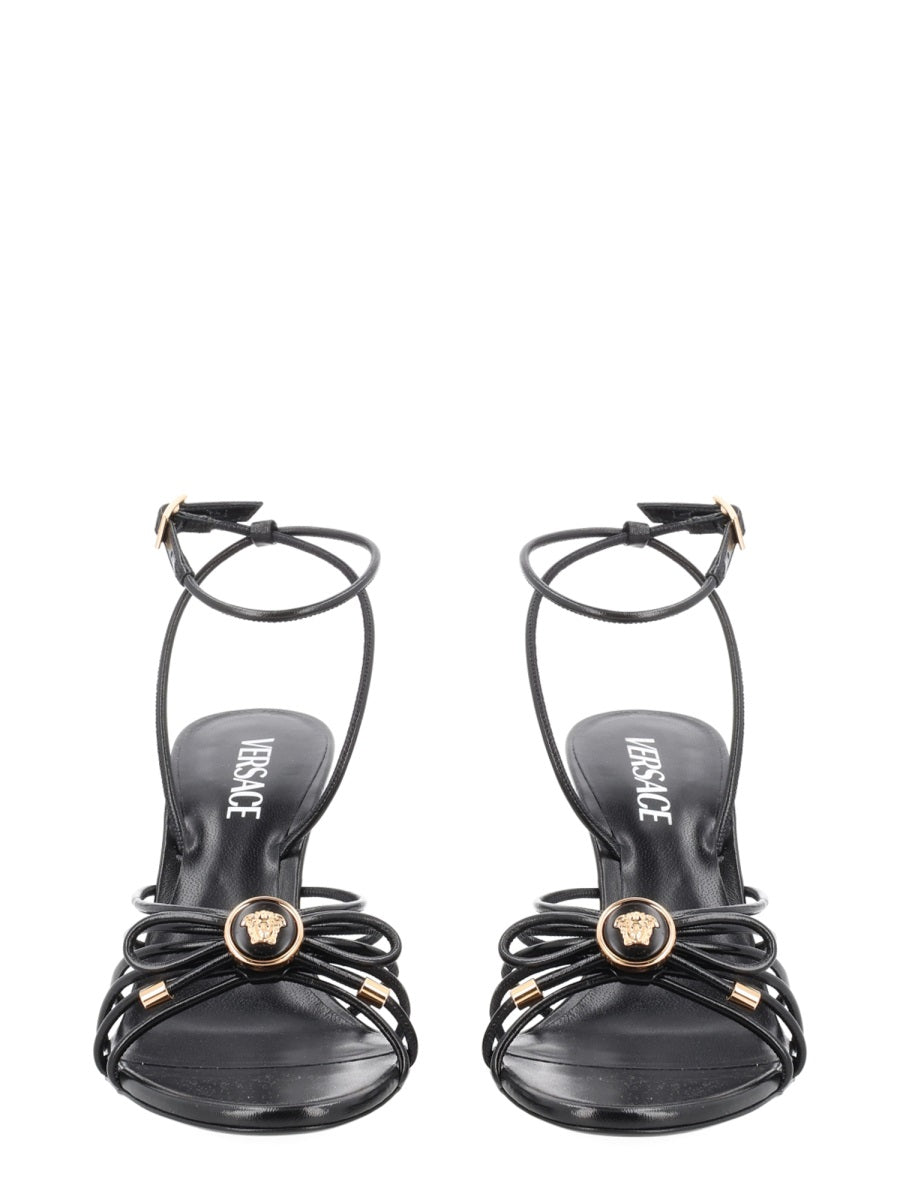 Opera Bow Gold-Tone Emblem Sandals